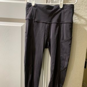 Lululemon size 2 smoky gray/black leggings, great condition, pockets on aides